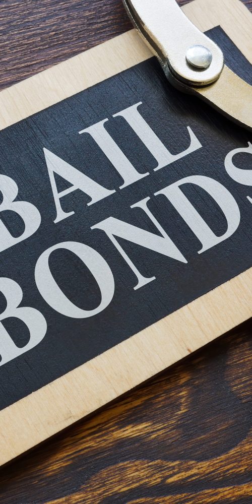 Plate Bail bonds and handcuffs on it.