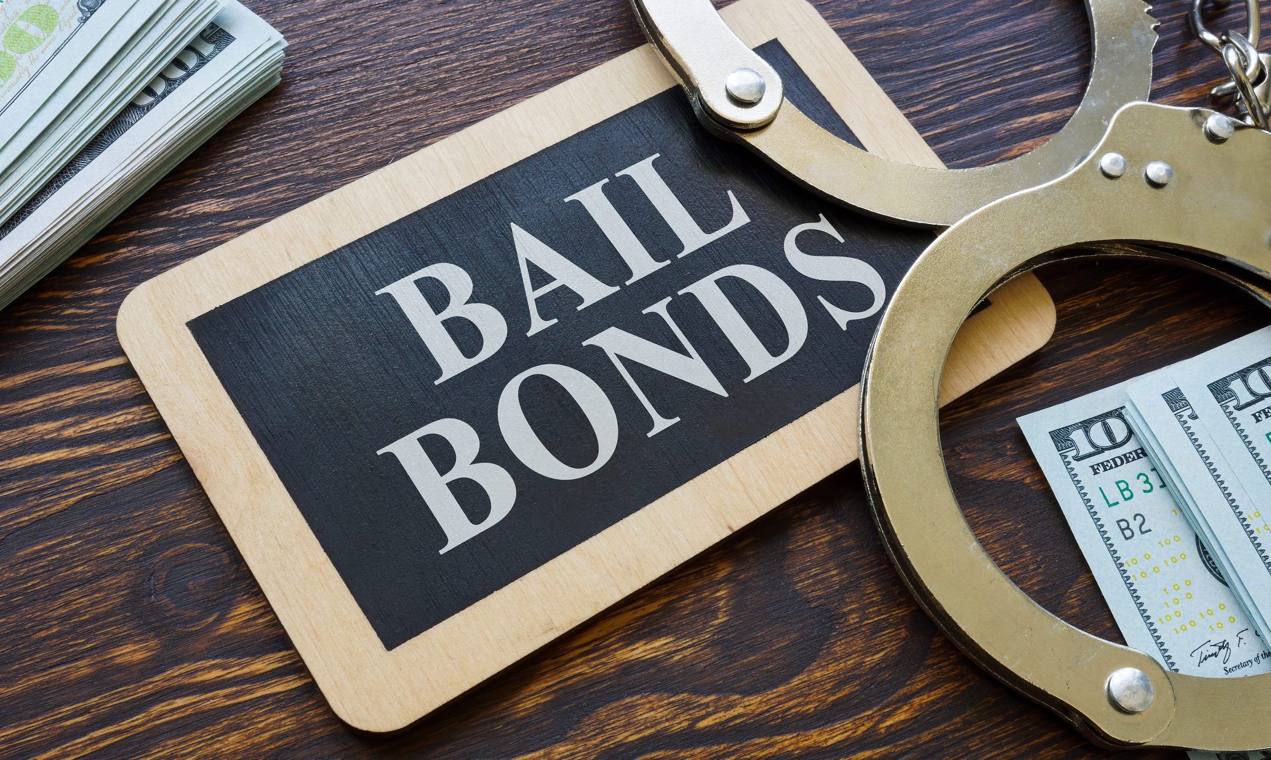 Plate Bail bonds and handcuffs on it.