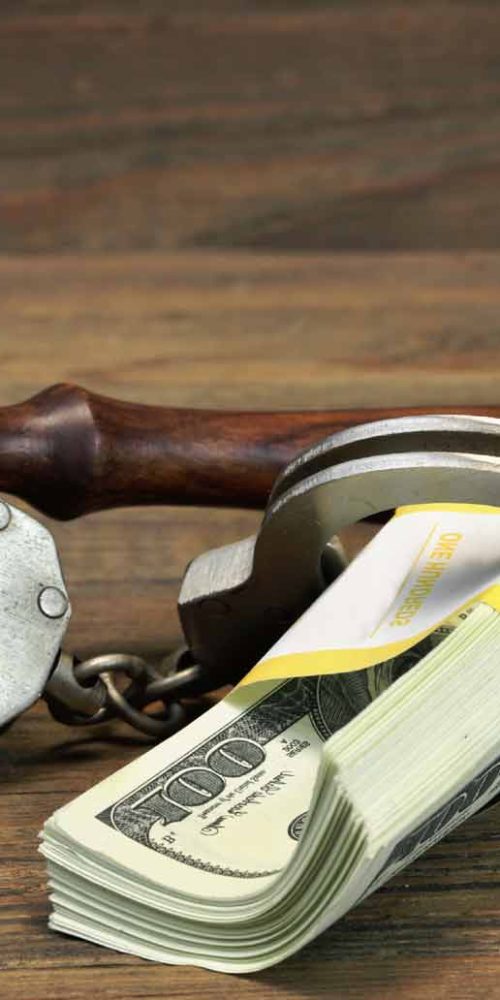 handcuffs, dollars and gavel