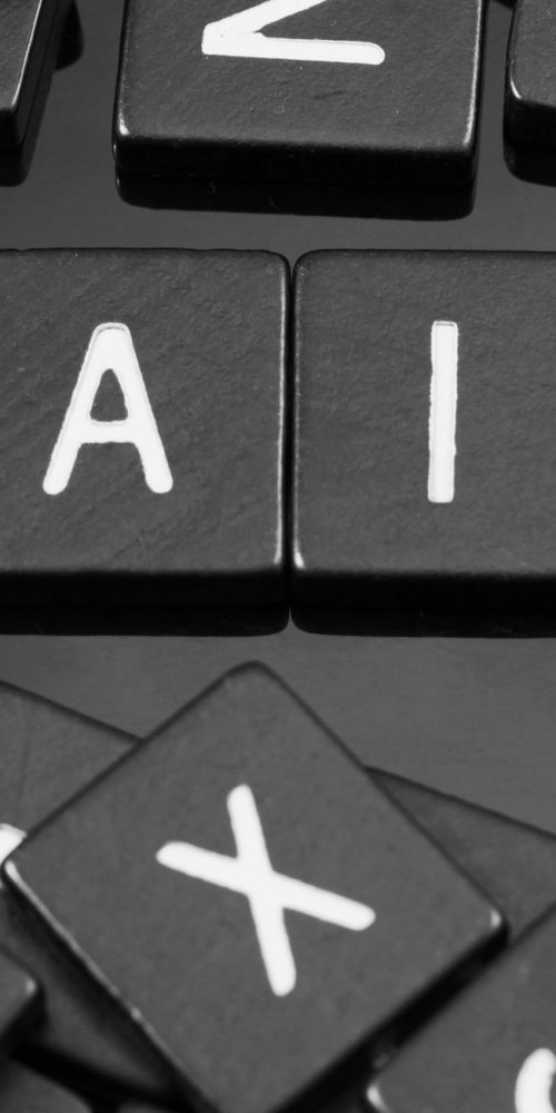 black letter tiles spelling the word "bail" on a reflective background