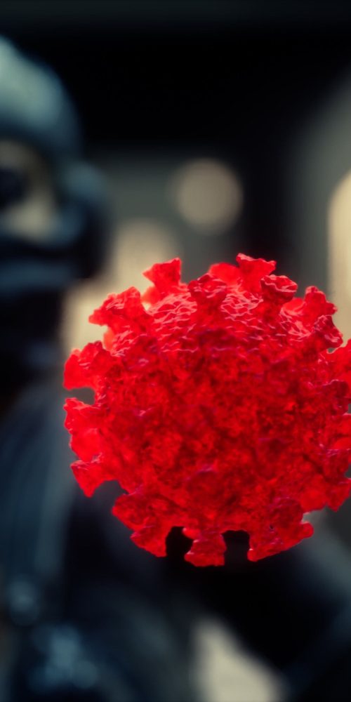 woman in protective medical mask on her face looking at COVID-19 coronavirus